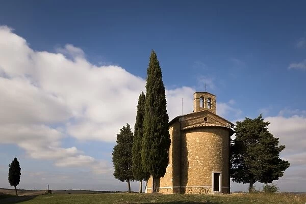 Back of Vitaleta chapel surrounded by Cypress trees, Val d Orcia