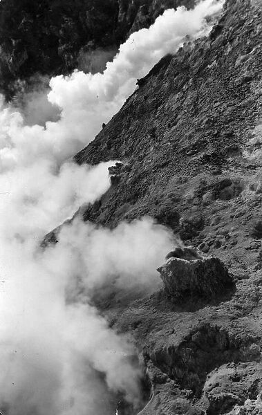 Volcano. circa 1960: Smoke escapes from a volcano