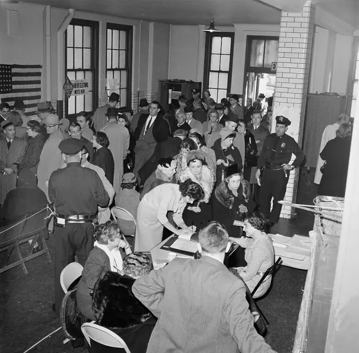Framed Print : Voting Officials Assisting Voters at Polling Place Framed Print : Voting Officials Assisting Voters at Polling Place