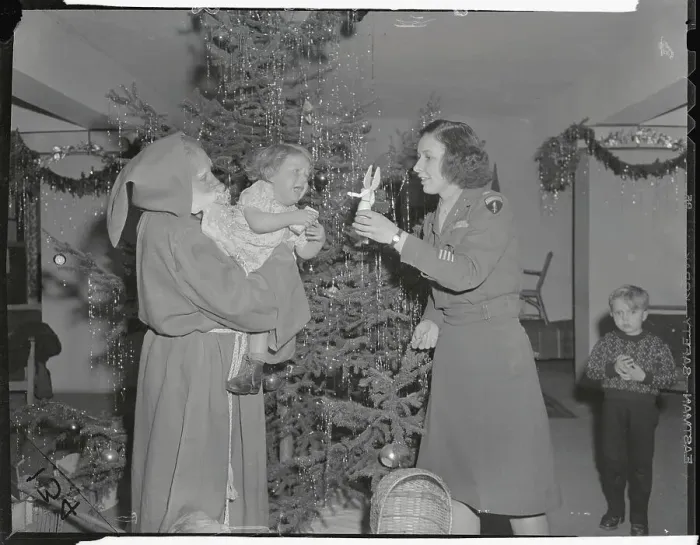Framed Print : WACs Playing Santa for Displaced Child Framed Print : WACs Playing Santa for Displaced Child