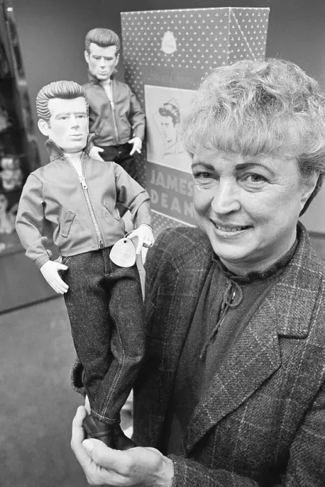 Framed Print : Waist-Up Woman Holds James Dean Doll