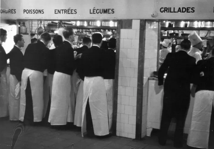 Framed Print : Waiting. 1940: Waiters give their orders in the main restaurant kitchen at the Savoy Hotel Framed Print : Waiting. 1940: Waiters give their orders in the main restaurant kitchen at the Savoy Hotel