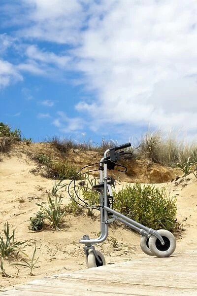 Walking frame left on the beach
