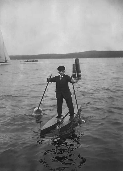 Walking On Water. A man, with two small boats on his feet