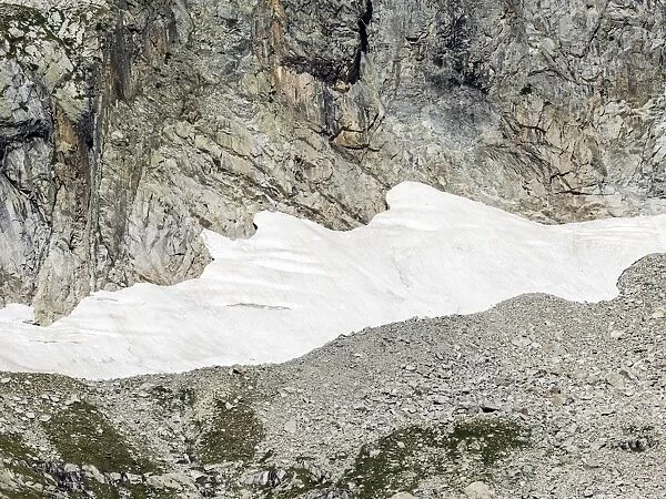 Wall detail high mountain about 3000 meters, in summer with snow on its slopes