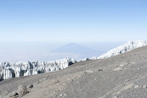 Wall of ice, Kersten Glacier on the crater rim of Kibo, summit of Uhuru Peak, extinct volcano, with Mount Meru in the distance, Kilimanjaro National Park, Marangu Route, Tanzania, East Africa, Africa