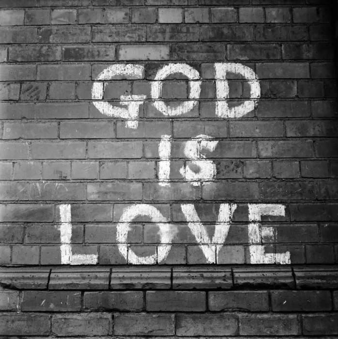 Framed Print : Wall Sign. 20th February 1954: A painted sign on a wall in Belfast reading God Is Love Framed Print : Wall Sign. 20th February 1954: A painted sign on a wall in Belfast reading God Is Love