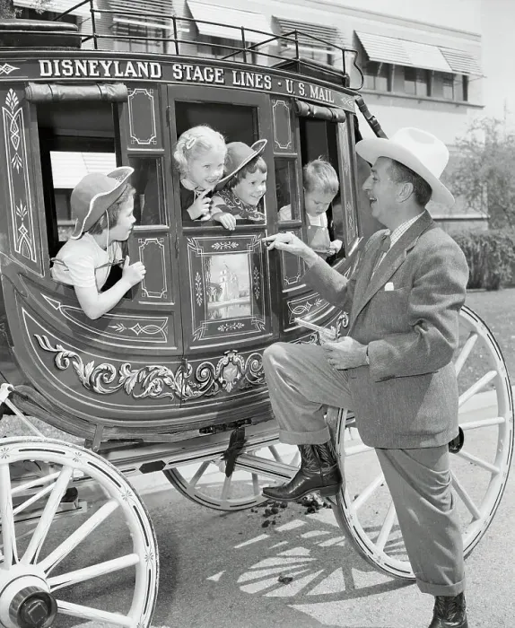 Framed Print : Walt Disney Holding Up Stagecoach Full of Children Framed Print : Walt Disney Holding Up Stagecoach Full of Children