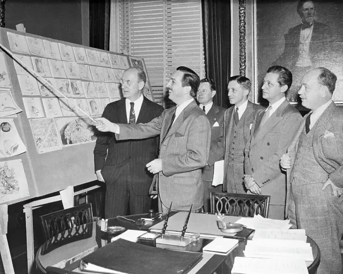 Framed Print : Walt Disney Pointing to Sketches on Board Framed Print : Walt Disney Pointing to Sketches on Board
