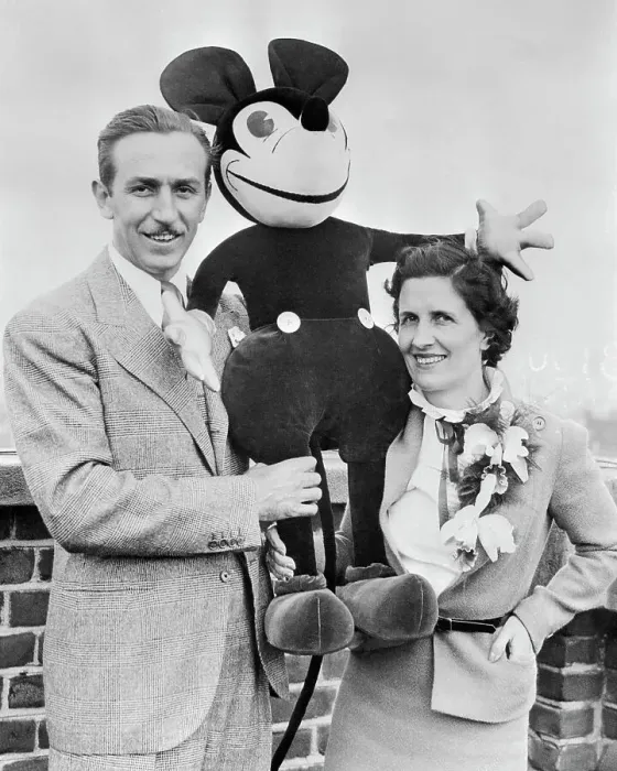 Framed Print : Walt and Mrs. Disney Standing with Stuffed Mickey Mouse Framed Print : Walt and Mrs. Disney Standing with Stuffed Mickey Mouse