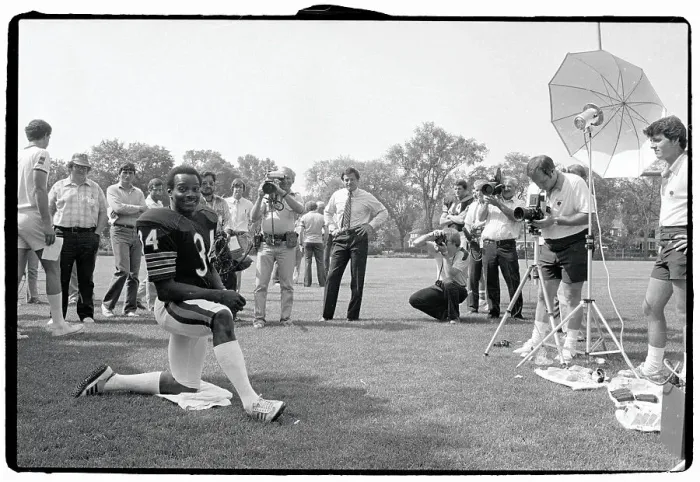 Framed Print : Walter Payton Poses on One Knee for Photographers