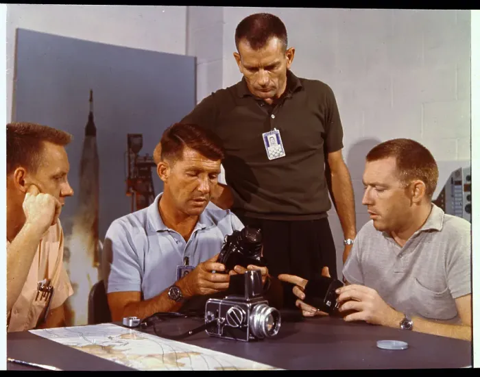 Framed Print : Walter Schirra Inspecting Camera Equipment