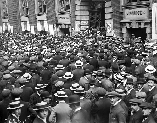 War Work. June 1916: Crowds of men gathered outside Great Scotland Yard