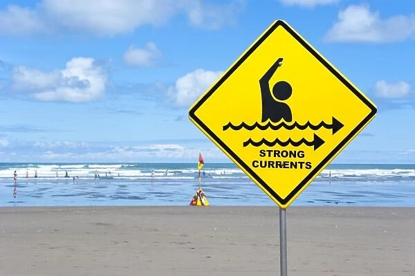 Warning sign strong currents, on a beach, Muriwai Beach, West Coast, Auckland, Auckland Region, New Zealand