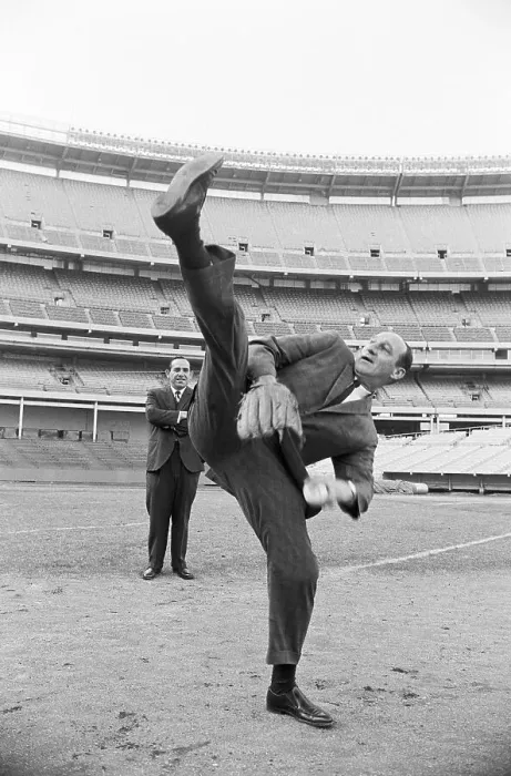 Framed Print : Warren Spahn Does High Leg-Kick In Suit Framed Print : Warren Spahn Does High Leg-Kick In Suit