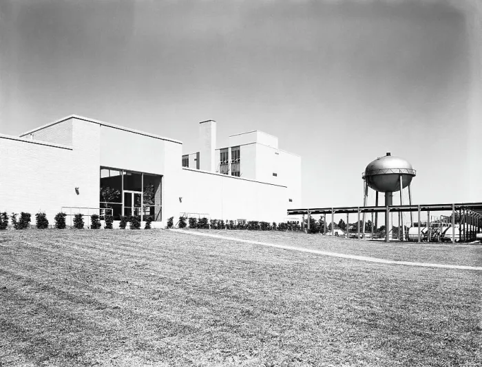Framed Print : Water purification plant building, with water tower and well maintained grass lawn Framed Print : Water purification plant building, with water tower and well maintained grass lawn