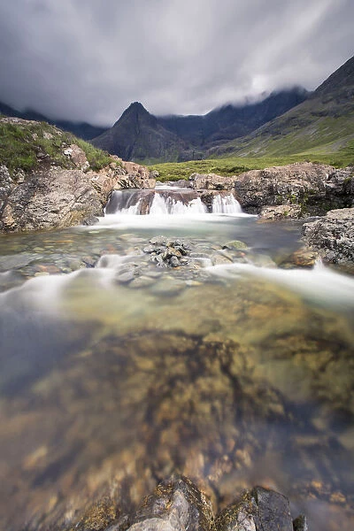 Waterfall in Fairy Pools rocky stream on Isle of Skye Scotland Europe
