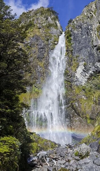 Waterfall with a rainbow, Devils Punchbowl Falls, Arthurs Pass, South Island, New Zealand