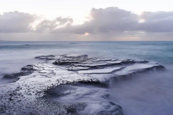 Framed Print : Waves breaking over sandstone platforms, Arniston, Western Cape, South Africa