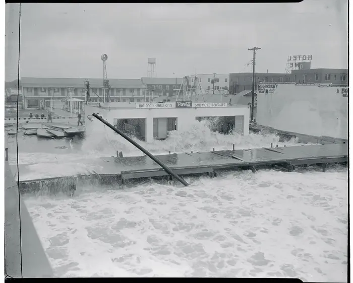 Framed Print : Waves Crashing Against a Small Beach Restaurant