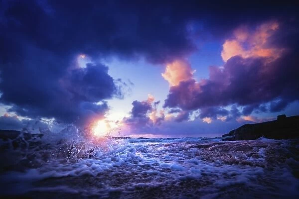 Waves splashing at sunset