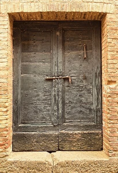 This Way. Rustic doorway Siena Tuscany Italy