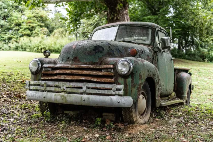 Framed Print : Weathered vintage truck abandoned in field close-up