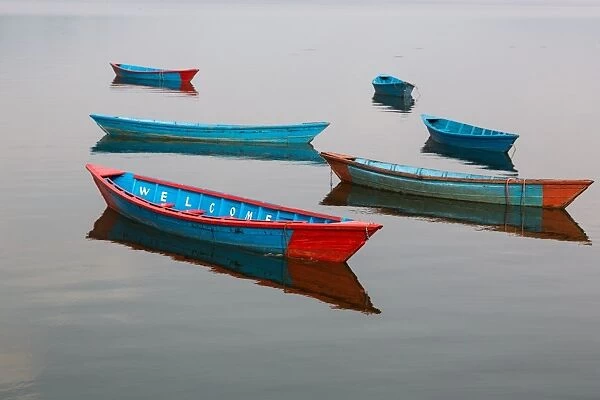 Welcome. Wooden boats on Phewa lake in Pokhara, Nepal