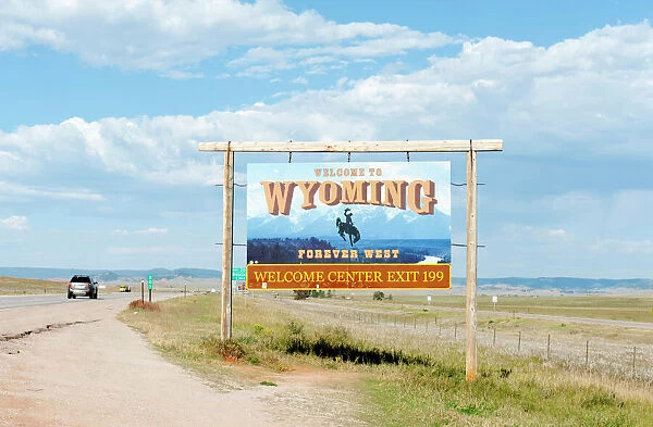 Welcome sign on a highway, Welcome to Wyoming, Forever West, flat landscape, Wyoming, USA