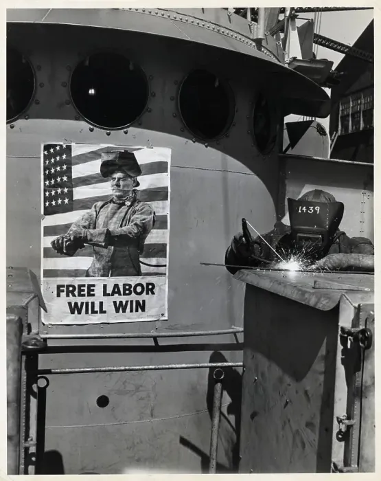 Framed Print : Welder Working Witgh Poster In Back Framed Print : Welder Working Witgh Poster In Back