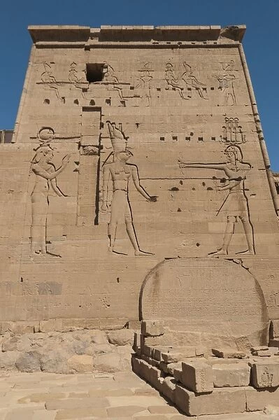 Well-preserved carved relief of the pylon at the Temple of Isis in Philae