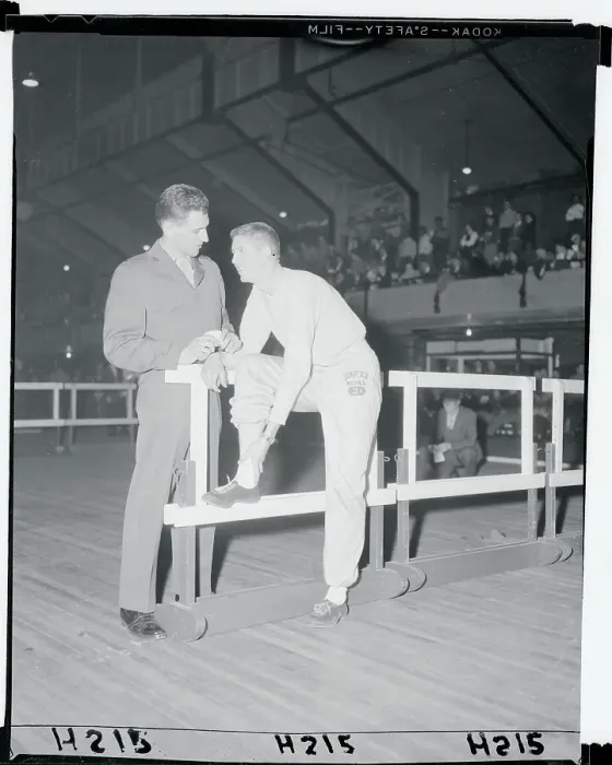 Framed Print : Wes Santee Showing His Leg to Tom Rosandich