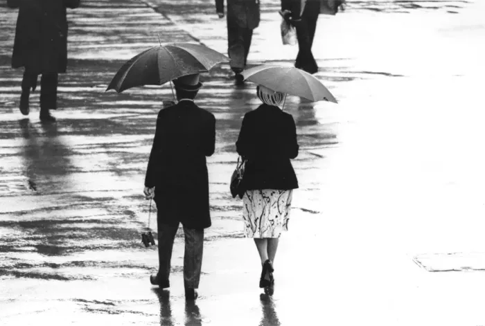 Framed Print : Wet Ascot. 20th June 1980: A couple stroll under brollies in rain at first day at Ascot