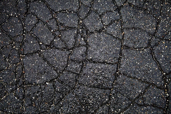 Wet cracked asphalt