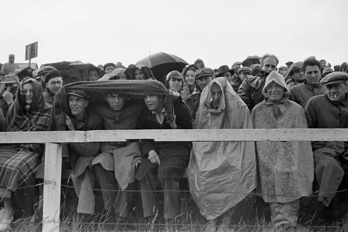 Framed Print : Wet Fans. 8th July 1939: Spectators brave the elements for the sake of Framed Print : Wet Fans. 8th July 1939: Spectators brave the elements for the sake of