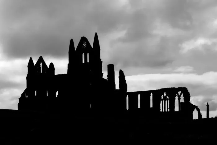Framed Print : Whitby Abbey silhouetted against a cloudy sky, North Yorkshire, England Framed Print : Whitby Abbey silhouetted against a cloudy sky, North Yorkshire, England