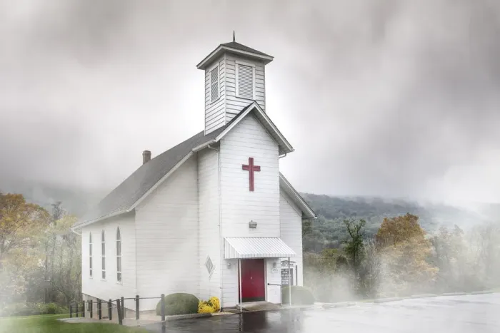 Framed Print : White church in the misty mountains