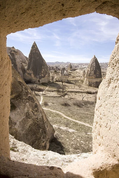 White rocky conical formations and dwellings