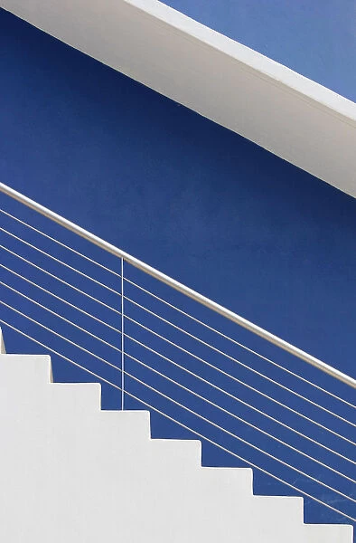 White steps in front of a blue wall