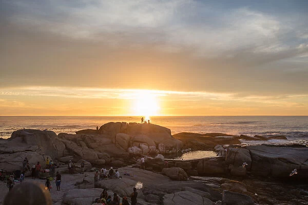 Wide angle shot of the sun rising over the sea, Cape Town, Western Cape, South Africa