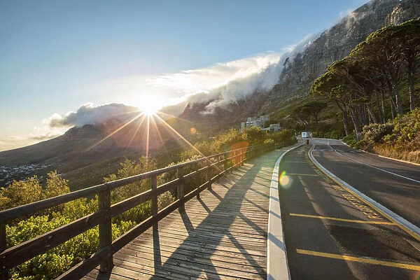 Wide shot of the sun rising over Table Mountain, Cape Town, Western Cape, South Africa