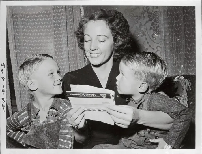 Framed Print : Wife of War Hero Reading to Her Children Framed Print : Wife of War Hero Reading to Her Children