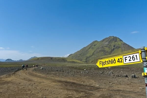 Wild gravel road with a traffic sign to Fljotshlid, Laugavegur trekking route, near Hvanngil, Highlands, Sudurland, Iceland