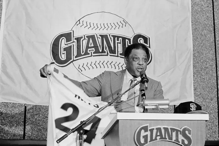 Framed Print : Willie Mays Holding Jersey at Press Conference Framed Print : Willie Mays Holding Jersey at Press Conference