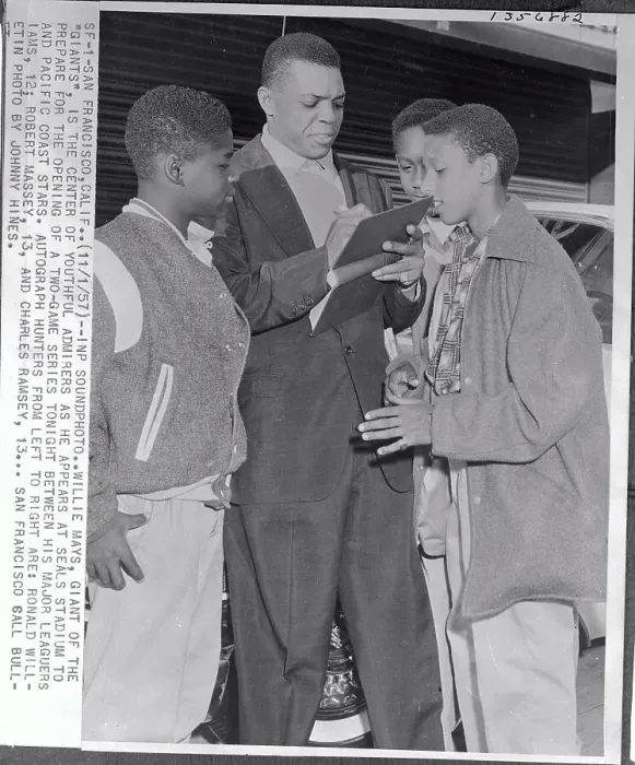 Framed Print : Willie Mays Signing an Autograph for Group of Fans Framed Print : Willie Mays Signing an Autograph for Group of Fans