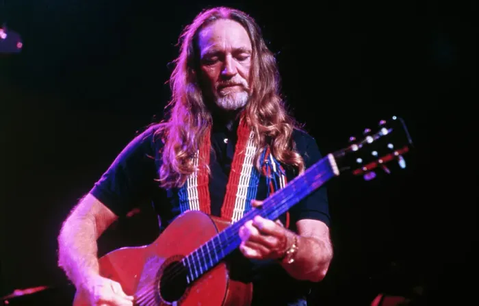 Framed Print : Willie Nelson Stroking Guitar Framed Print : Willie Nelson Stroking Guitar