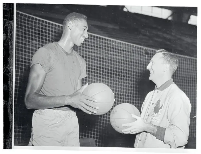 Framed Print : Wilt Chamberlain and Dick Harp Conversing Framed Print : Wilt Chamberlain and Dick Harp Conversing
