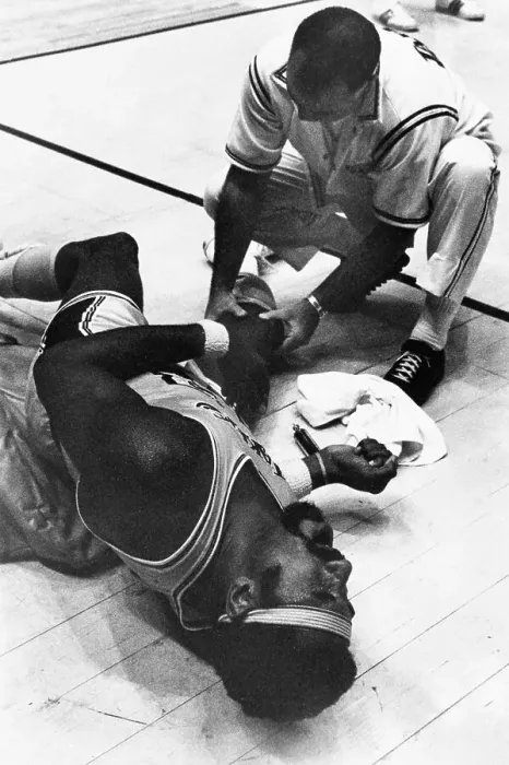 Framed Print : Wilt Chamberlain Lays On The Court In Pain