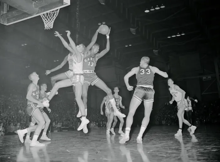 Framed Print : Wilt Chamberlain Leaping over Others Framed Print : Wilt Chamberlain Leaping over Others