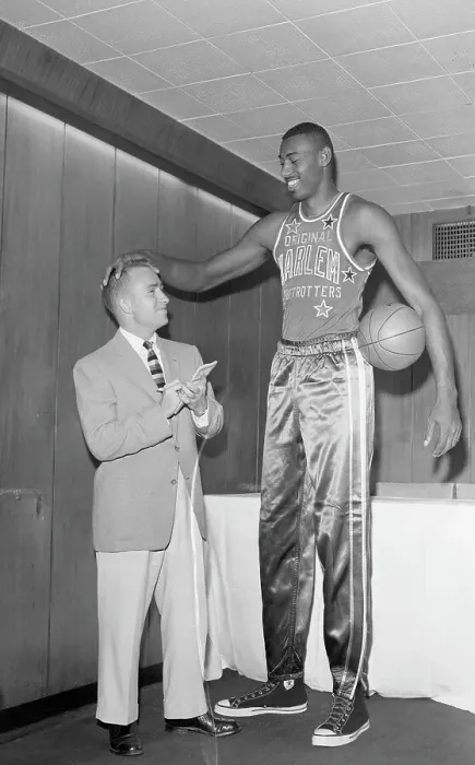 Framed Print : Wilt Chamberlain Talking with Short Reporter Framed Print : Wilt Chamberlain Talking with Short Reporter